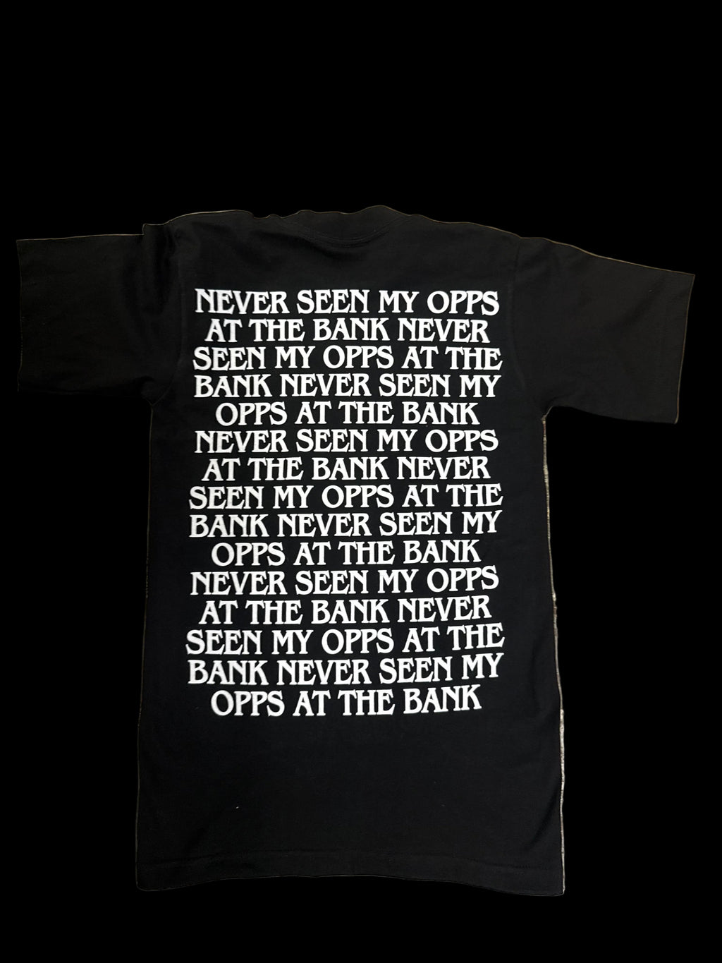 Back of PAID tshirt